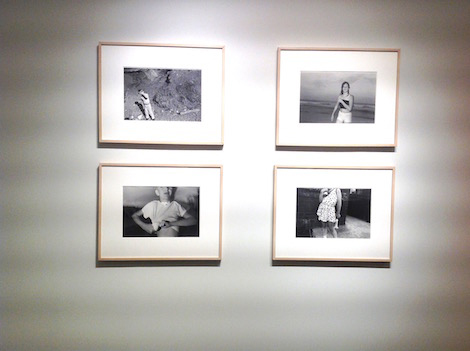 four black and white photographs framed on wall