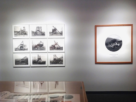 black and white photographs framed on wall