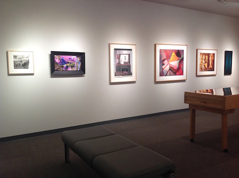 framed work on wall in gallery