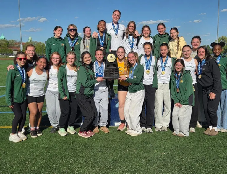 track and field team photo with championship