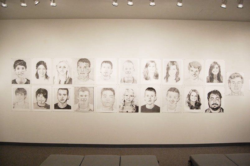 portraits of people on wall