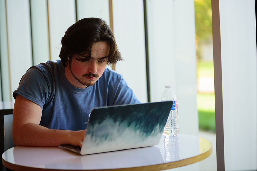 general student on a laptop