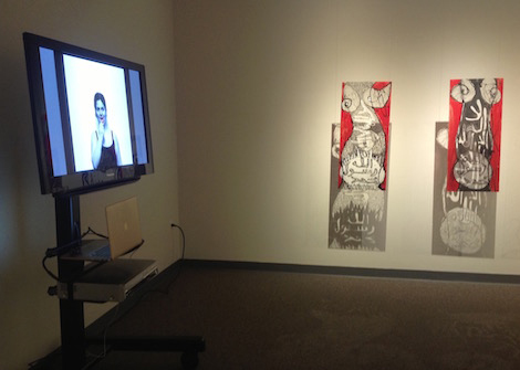 artwork on wall next to TV